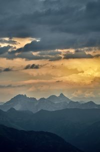 Scenic view of mountains against sky during sunset