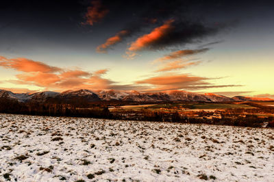 Scenic view of landscape against sky during sunset