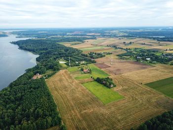 Scenic view of agricultural landscape against sky