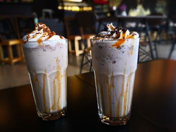 Close-up of drinks in glasses on table