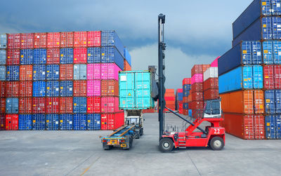 Forklift picking container at distribution warehouse