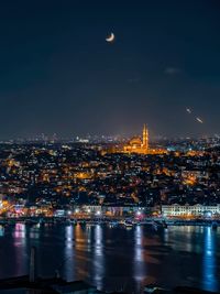 Illuminated buildings in city at night