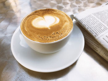 High angle view of cappuccino on table