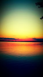 Scenic view of sea against romantic sky at sunset