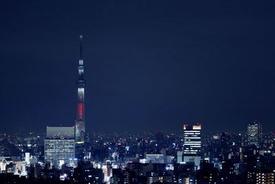 Illuminated buildings in city at night