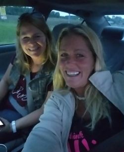 Portrait of smiling girl sitting in car