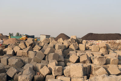 Stack of rocks on shore against clear sky