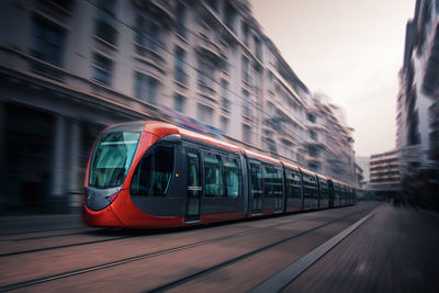 Train in city against sky