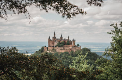 Castle on hill against sky