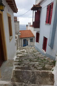 Houses in city against sky