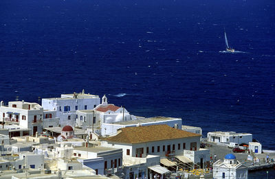 High angle view of townscape by sea