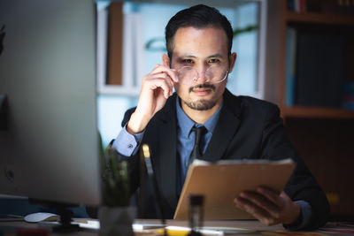 Portrait of young man using smart phone