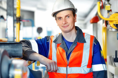 Portrait of engineer working in factory