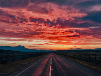 Scenic view of road against sky during sunset