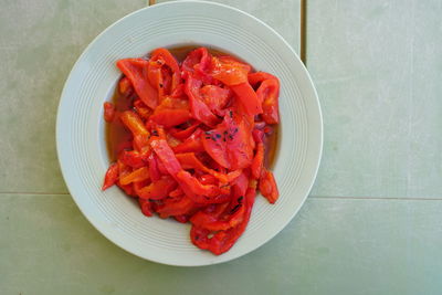 High angle view of chopped fruits in plate on table