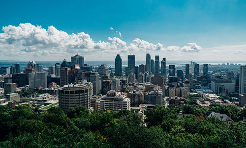 Modern buildings against sky in city