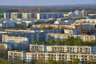 High angle view of buildings in city against sky