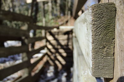 Close-up of cross on wood