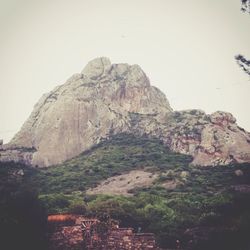 Low angle view of rock formation against clear sky