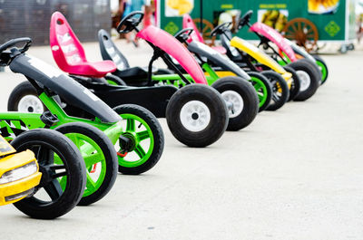 Toy vehicles parked in row outdoors