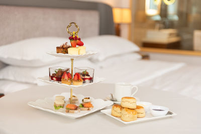 Hotel 3 tier pastries set on the bed