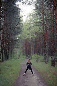 Man cycling on footpath in forest