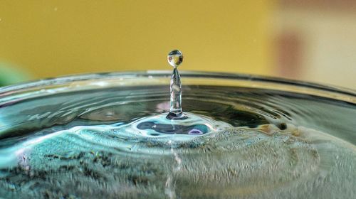 Close-up of drop falling in water