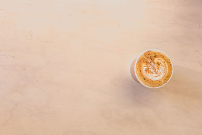 Directly above shot of coffee cup on table