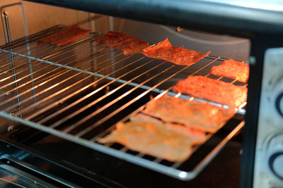 High angle view of meat on barbecue grill