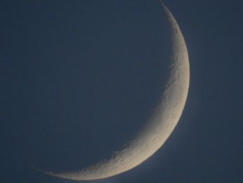 Low angle view of moon against sky at night