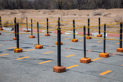 Row of railing by road