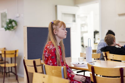 Girl sitting in classroom