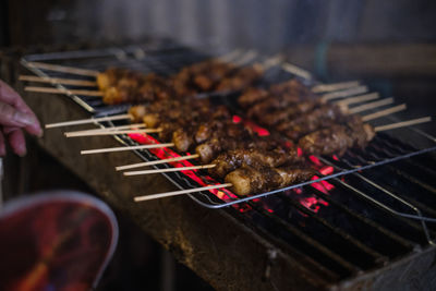 High angle view of meat on barbecue grill