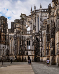 Group of people in front of historic building