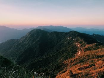 Scenic view of mountains against sky during sunset