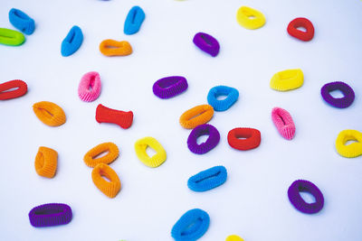 Directly above shot of yellow pills on white background