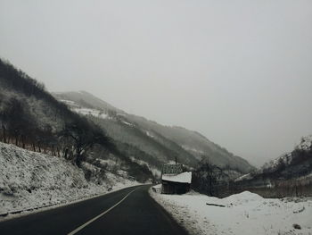 Country road leading towards mountains