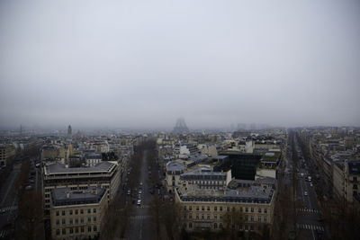 High angle view of city buildings against clear sky