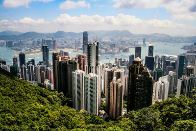 Panoramic view of cityscape against cloudy sky