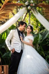 Prewedding couple in white dress outdoors