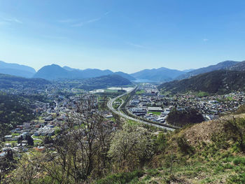 High angle view of road by mountains against sky