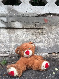 Close-up of stuffed toy on wall