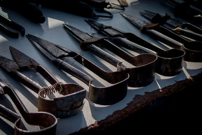 High angle view of work tools on bench at workshop