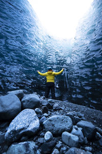 Rear view of man swimming in sea