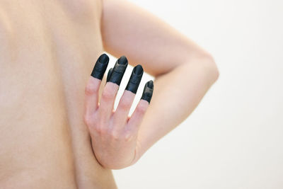 Close-up of woman hand on white background