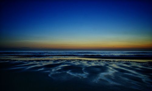 Scenic view of sea at sunset