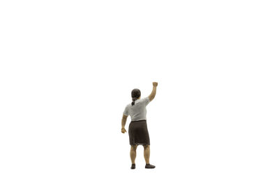 Rear view of man standing against white background