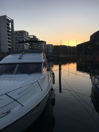 Sailboats in marina at sunset