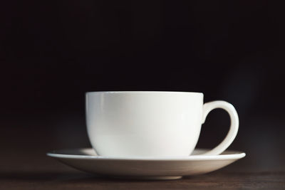 Close-up of coffee cup on table