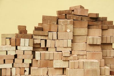 Stack of wood against sky